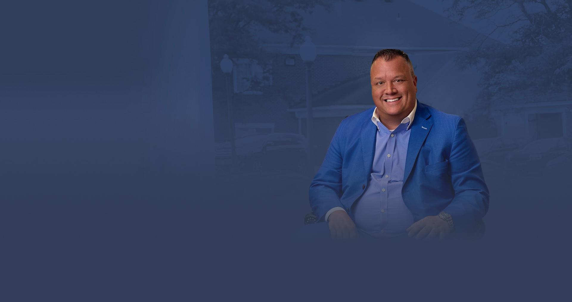 Navy blue graphic background image with Attorney Thomas Erb Jr. Overlayed on the image